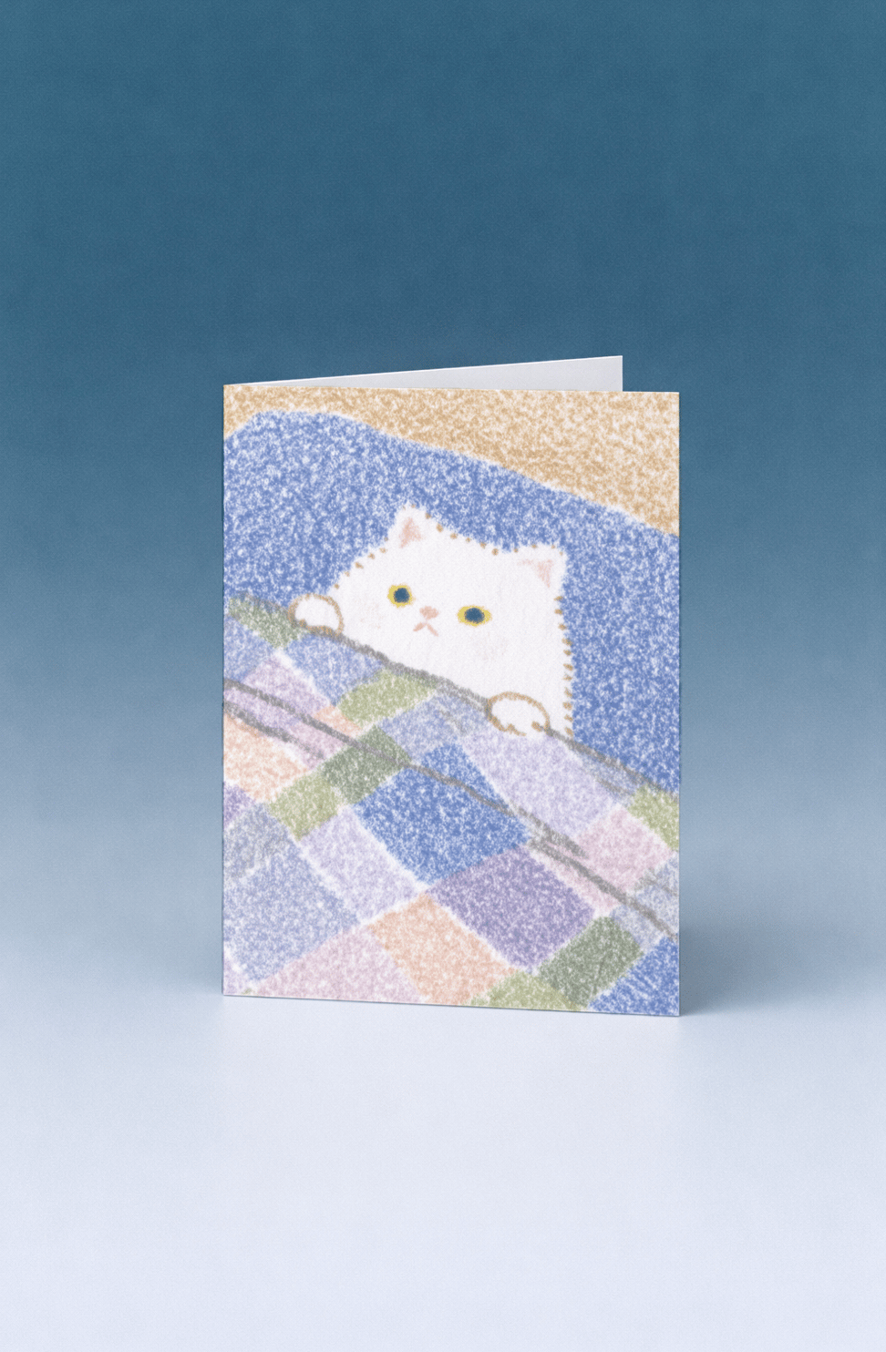 white cat tucked into bed mockup 5